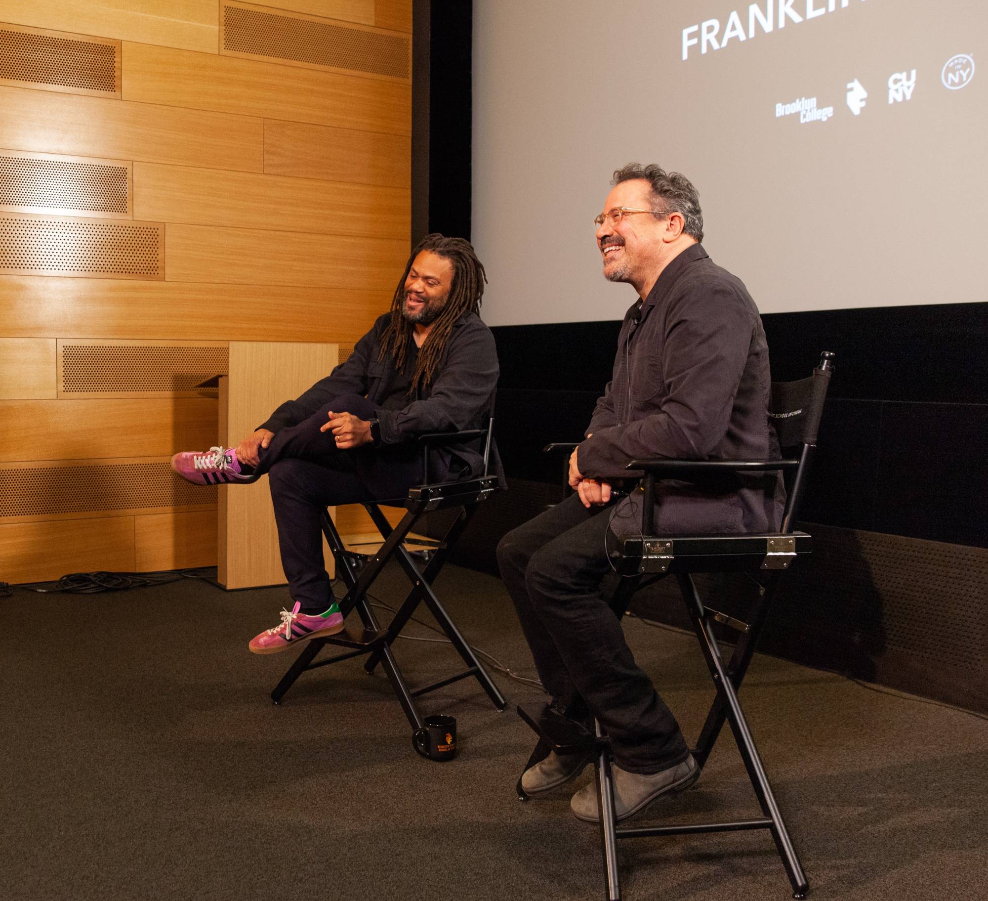 Franklin Leonard laughing on stage during a Q&A